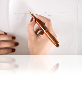 woman signing a contract